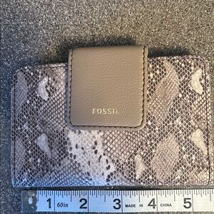 Pretty. Faux snakeskin. Snap closure. Outside zippered compartment.